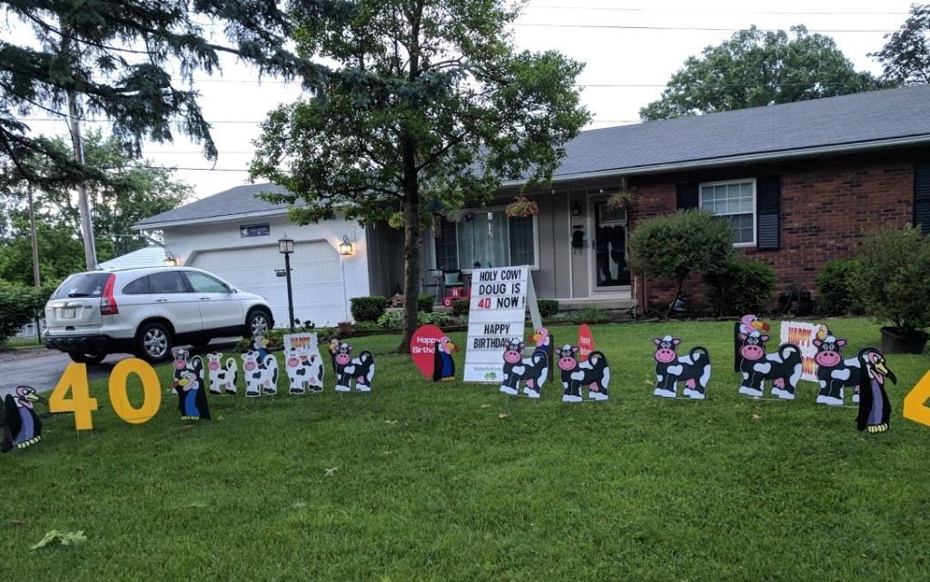 Cow and vulture yard signs for Doug's 40th birthday holy cow