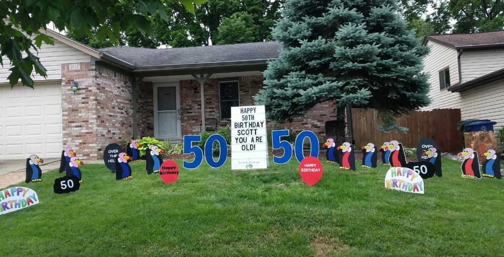 Penguin yard signs for Amy's 40th birthday aging like a fine wine