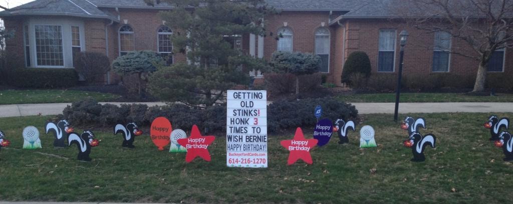 Skunk yard signs for Bernie's birthday getting old stinks honk 3 times