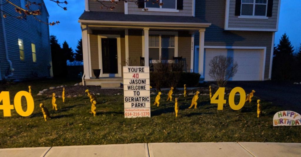 Yard sign celebrating Jason's 40th birthday with Geriatric Park dinosaur theme