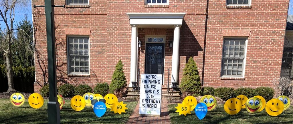 Yellow smiley face lawn decorations for Andy's 50th birthday