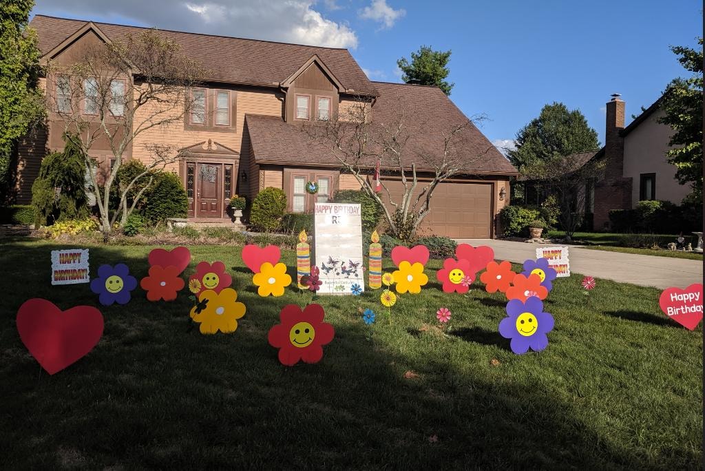 Colorful flower yard signs for R.T.'s birthday celebration