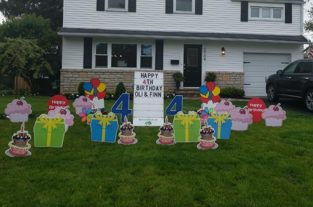 Colorful birthday yard signs for Oli and Finn's 4th birthday