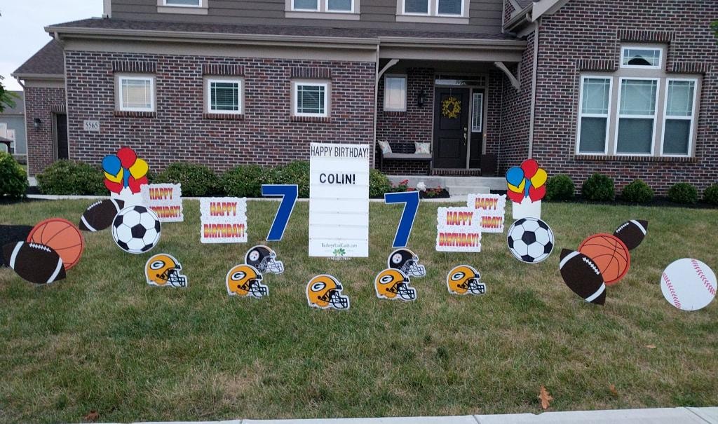 Sports helmet themed birthday yard sign display for Colin's 7th birthday