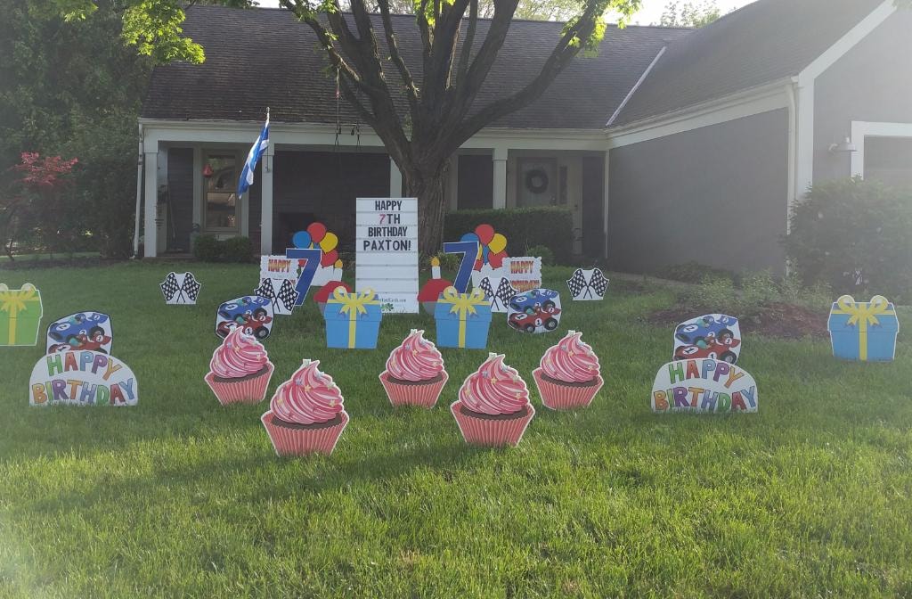 Race car themed birthday yard sign display for Paxton's 7th birthday