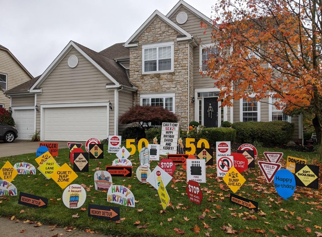 Large road sign yard display for David and Kerry's 50th birthday celebration